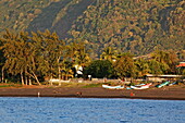 View of people and boats on the beach, Saint Paul, La Reunion, Indian Ocean