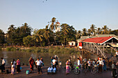 People waiting at ferry port at the Ayeyarwady River in Rangon, Myanmar, Birma, Asia