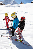 Children skiing on fresh primed ski piste, Schlosslelift, Hirschegg, Kleinwalsertal, Vorarlberg, Austria