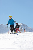 Children skiing, Schlosslelift, mount Barenkopf in background, Hirschegg, Kleinwalsertal, Vorarlberg, Austria