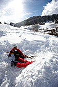 Children playing in snow, Hirschegg, Kleinwalsertal, Vorarlberg, Austria