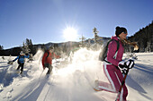 People snowshoeing in snowy landscape, Hemmersuppenalm, Reit im Winkl, Chiemgau, Upper Bavaria, Bavaria, Germany, Europe