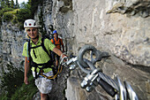 Couple climbing at Gamssteig fixed rope route, Steinplatte, Reit im Winkl, Chiemgau, Upper Bavaria, Bavaria, Germany, Europe