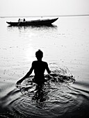 Pilgrims bathing at ghat steps on river Ganges Gats in Varanasi banaras Uttar Pradesh India