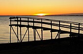 Wooden pier on Lake Winnipeg at dawn