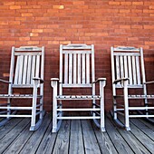 Line of old rocking chairs