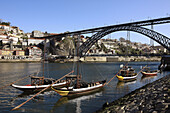 Rabelos Port wine carring barges, Douro river and Dom Luis I Bridge, Porto, Portugal