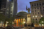 Statue of Paul de Chomedey de Maisonneuve and Bank of Montreal in Place d'Armes square, Montreal, Quebec, Canada