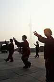 Early morning tai chi exercises on the Bund, Shanghai, China