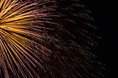 Gold, Red and White Fireworks display in the Night Sky, Terrebonne, Quebec, Canada
