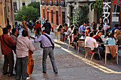 Group Of Musicians In Front Of The Bar Gastronomico Korgui, Calle Rollo, Madrid, Spain