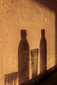 Shadow Of A Cold Drink On An Adobe Or Pise Wall, Terres d'Amanar, Tahanaoute, Morocco