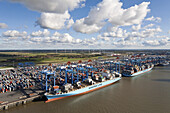 Aerial view of a container port with loading cranes, terminal and ships along the pier, Bremerhaven, Bremen, Germany