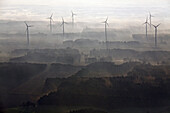 Aerial view of a wind farm in the early morning mist, Lower Saxony, Northern Germany