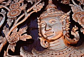 Image of a Buddha at the front door of a temple