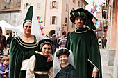 Family in traditional costumes, Palio, Alba, Langhe, Piedmont, Italy