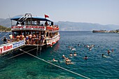Tourists on boat excursion near Oludeniz Province of Mugla, Turkey