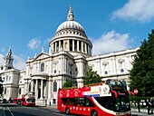 St Pauls Cathedra, l London, UK, and Red Tourist Open Top Tour Bus