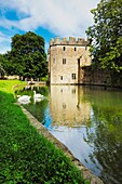 The moat and the Gatehouse to the Bishop’s Palace and gardens in the city of Wells in Somerset, England