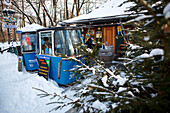 Snow-covered beer garden with gondolas