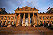 Visitors in front of the Reichstag building, Berlin, Germany