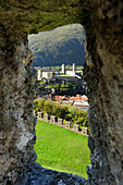 Arrow slit of Castle Montebello with view to Castelgrande, Bellinzona, UNESCO World Heritage Site Bellinzona, Ticino, Switzerland, Europe