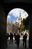 The Cathedral and the Giralda Tower as seen through the Patio de Banderas archway Seville, Spain