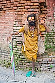 Sadhu covered with traditional ash and body paint At Pashupatinath Temple Kathmandu Valley Nepal