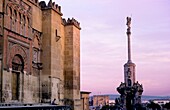 Cordoba Andalusia Spain: At left Mosque-cathedral's walls and Triumph of San Rafael at right, in Torrijos street