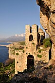 The 13th century Byzantine church of Odigitria, known localy asAgitria,  set in a dramatic location In The Deep Mani, near Stavri, in the middle distance is the Tigani peninsular, with the Taygetos mountains in the background Southern Peloponnese, Greec