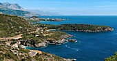 Looking down the coast of the Outer Mani, with Stoupa and its acropolis in the middle distance and Cavo Grosso and the Deep Mani in the background Messinia, Outer Mani, Southern Peloponnese, Greece