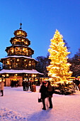 People at christmas market in the evening, Chinesischer Turm, Englischer Garten, Munich, Upper Bavaria, Bavaria, Germany, Europe