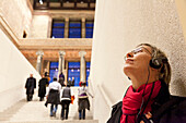 Visitor with audio guide inside of the Neues Museum (New Museum), Museum Island, Berlin, Germany