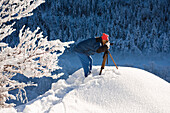 Nature photographer in snow, Upper Bavaria, Germany
