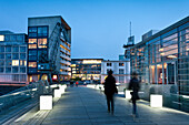 People and buildings at Media Harbour in the evening, Düsseldorf, Duesseldorf, North Rhine-Westphalia, Germany, Europe