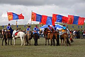 Horsemen with National flags at Naadam Festival, Mongolia
