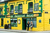 Dingle, west Kerry, famous for its pubs, music and relaxed atmosphere Two young women smoking outside the An Droicead Beag bar