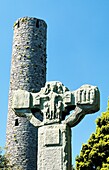 The Unfinished Cross and Round Tower in Celtic Christian churchyard at Kells in County Meath, Ireland