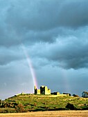 Mediaeval cathedral, round tower and Cormac’s Chapel sit on the Rock of Cashel, County Tipperary, Ireland Sunlit with rainbow