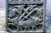 Base panel on the Moone Cross, County Kildare, Ireland Celtic Christian Wild boar motif with 4 boars head carnyx war trumpets