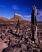 Lindisfarne Castle from rocky beach, Holy Island, Northumberland, UK - England