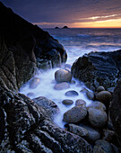 View to The Brisons rocks at sunset, Porth Nanven, Cornwall, UK - England