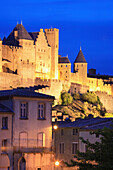 Walled city and Old Town street at night, Carcassonne, Languedoc-Roussillon, France