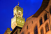 Belltower of the Palazzo Vecchio and street at night, Florence, Tuscany, Italy