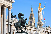Parliament  with statues and Rathaus - City Hall, Vienna, Austria