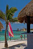 View across bay with colourful hobie cat, Puerto Aventuras, Quintana Roo, Mexico