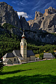 Parish church and north face of Sella mountains, Colfosco, Italian Dolomites, Italy