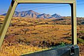 Grassland and savannah seen through vehicle window, Namibia