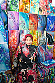 Woman selling colourful fabric, Little India, Kuala Lumpur, Malysia, Asia