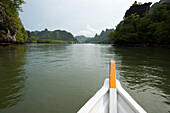 Boat on a lake at Kilim Geoforest Park in the north-east of Lankawi Island, Malaysia, Asia